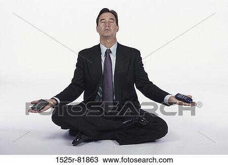 Businessman sitting on the floor meditating View Large Photo Image Stock Image - Businessman sitting on the floor meditating. Fotosearch