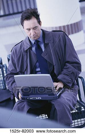 Stock Image - Businessman working on a laptop. Fotosearch