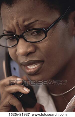 Businesswoman talking on a telephone View Large Photo Image Stock Photo - Businesswoman talking on a telephone. Fotosearch