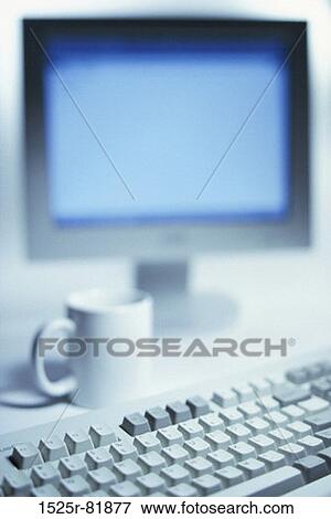 Close-up of a computer keyboard in front of a computer monitor View Large Photo Image Stock Photo - Close-up of a computer keyboard in front of a computer monitor. Fotosearch