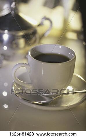 Close-up of a cup of coffee View Large Photo Image Stock Photo - Close-up of a cup of coffee. Fotosearch