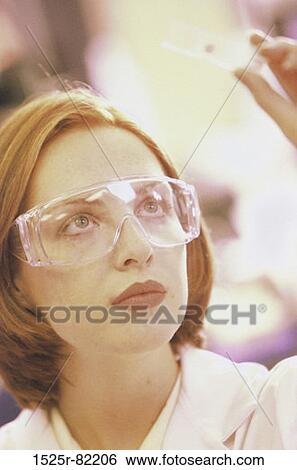Close-up of a female researcher View Large Photo Image Stock Photograph - Close-up of a female researcher. Fotosearch