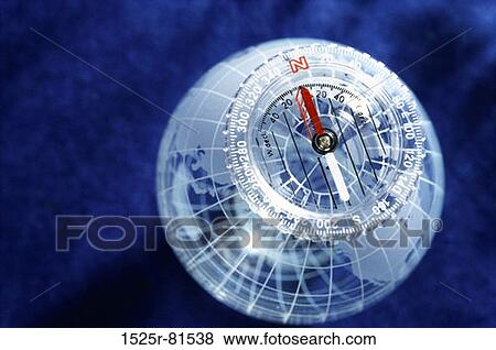 Stock Photo - Close-up of a globe with a compass. Fotosearch