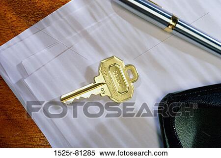 Close-up of a key on sheets of paper View Large Photo Image Stock Photography - Close-up of a key on sheets of paper. Fotosearch