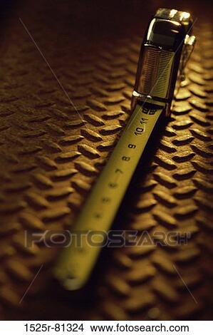 Close-up of a measuring tape View Large Photo Image Picture - Close-up of a measuring tape. Fotosearch