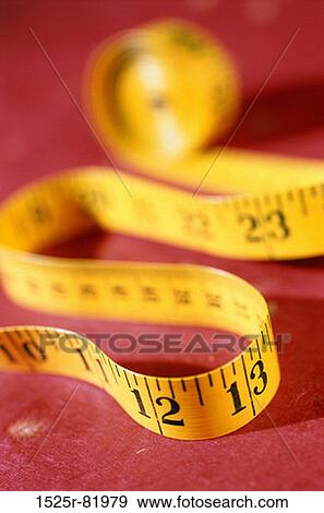 Close-up of a measuring tape View Large Photo Image Stock Photo - Close-up of a measuring tape. Fotosearch