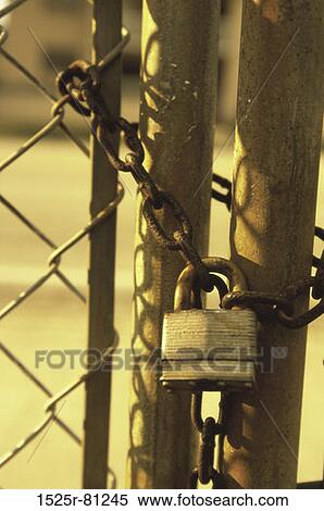 Stock Photography - Close-up of a padlock on a gate. Fotosearch