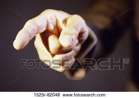 Close-up of a person pointing forward View Large Photo Image Stock Photo - Close-up of a person pointing forward. Fotosearch
