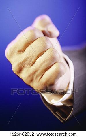 Stock Image - Close-up of a person's hand making a fist. Fotosearch