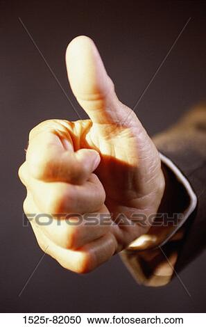 Close-up of a person's hand making the thumbs up sign View Large Photo Image Stock Image - Close-up of a person's hand making the thumbs up sign. Fotosearch