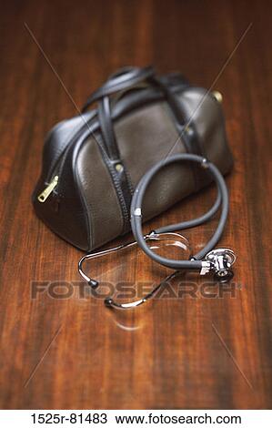 Close-up of a stethoscope and a doctors bag View Large Photo Image Stock Image - Close-up of a stethoscope and a doctors bag. Fotosearch