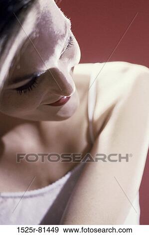 Stock Photo - Close-up of a young woman smiling. Fotosearch
