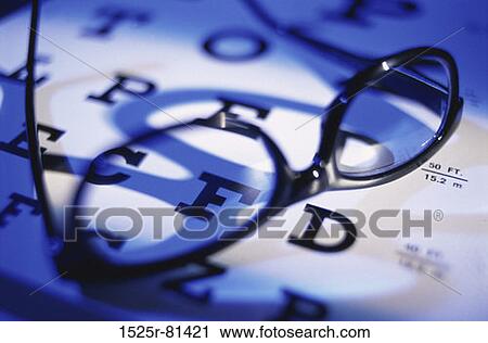 Close-up of eyeglasses on an eye chart View Large Photo Image Stock Image - Close-up of eyeglasses on an eye chart. Fotosearch