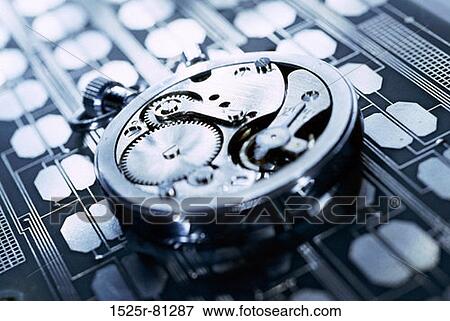 Close-up of gears in a watch View Large Photo Image Stock Photo - Close-up of gears in a watch. Fotosearch