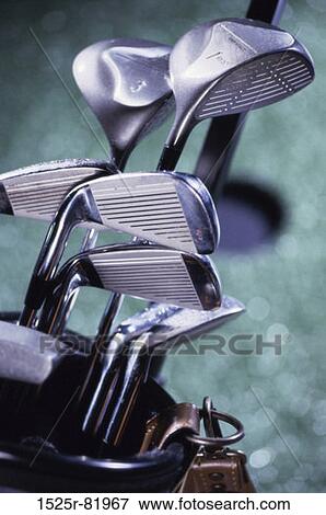 Stock Photo - Close-up of golf clubs in a golf bag. Fotosearch