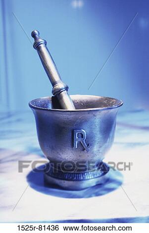 Close-up of mortar and pestle View Large Photo Image Stock Photograph - Close-up of mortar and pestle. Fotosearch