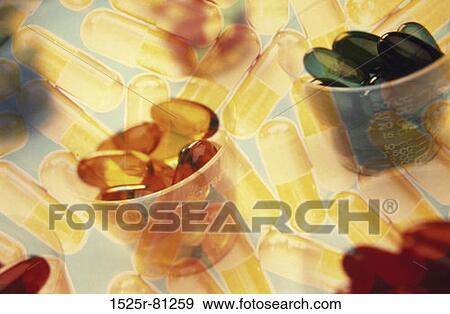 Close-up of pills and capsules in cups View Large Photo Image Stock Photo - Close-up of pills and capsules in cups. Fotosearch