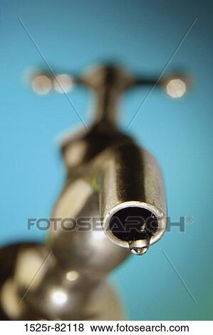 Close-up of water dripping from a faucet View Large Photo Image Stock Photo - Close-up of water dripping from a faucet. Fotosearch