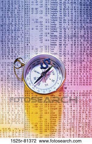 Stock Image - Compass and a dollar sign on a financial report. Fotosearch