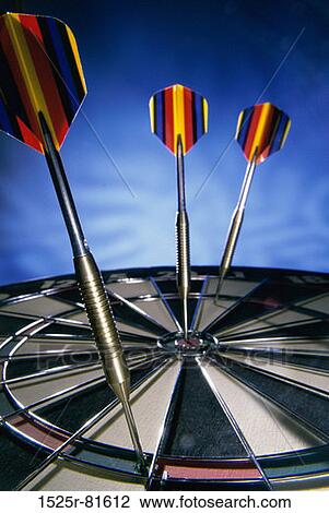 Stock Image - Darts on a dartboard. Fotosearch