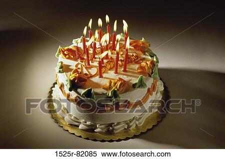 Decorated birthday cake with lit candles View Large Photo Image Stock Photography - Decorated birthday cake with lit candles. Fotosearch