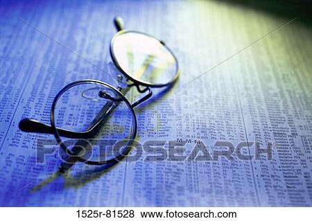 Eyeglasses on a newspaper View Large Photo Image Stock Photo - Eyeglasses on a newspaper. Fotosearch