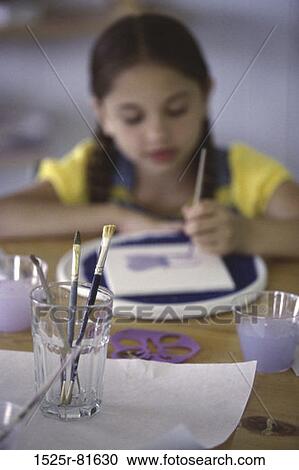 Girl painting with watercolor paints View Large Photo Image Stock Image - Girl painting with watercolor paints. Fotosearch