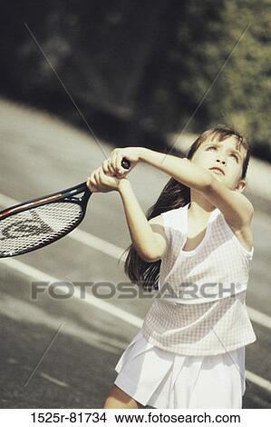 Girl playing tennis View Large Photo Image Picture - Girl playing tennis. Fotosearch