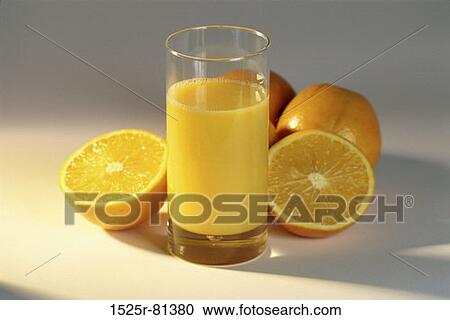 Glass of orange juice and oranges View Large Photo Image Stock Image - Glass of orange juice and oranges. Fotosearch