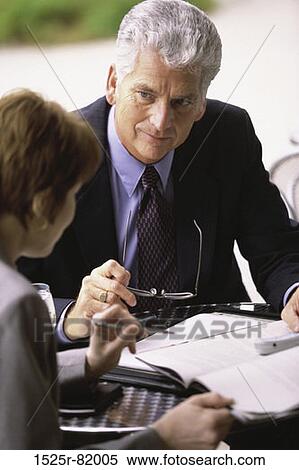 High angle view of a businessman and a businesswoman View Large Photo Image Stock Photography - High angle view of a businessman and a businesswoman. Fotosearch