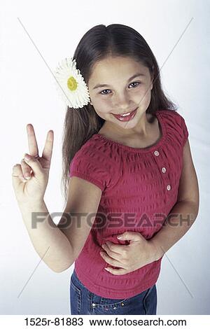 High angle view of a girl making a victory sign View Large Photo Image Stock Image - High angle view of a girl making a victory sign. Fotosearch