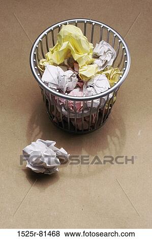 High angle view of a waste paper basket full of scrap paper View Large Photo Image Stock Photo - High angle view of a waste paper basket full of scrap paper. Fotosearch