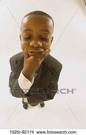 High angle view of a young boy dressed as a businessman View Large Photo Image Picture - High angle view of a young boy dressed as a businessman. Fotosearch