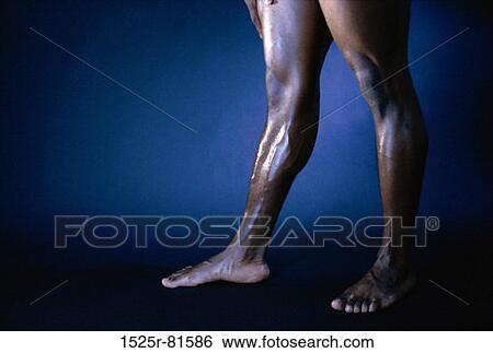 Low section view of the legs of a man View Large Photo Image Stock Photograph - Low section view of the legs of a man. Fotosearch