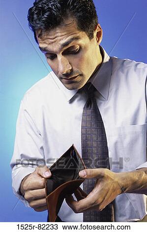 Man holding an empty wallet View Large Photo Image Stock Image - Man holding an empty wallet. Fotosearch