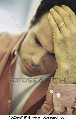 Man holding his head in pain View Large Photo Image Picture - Man holding his head in pain. Fotosearch
