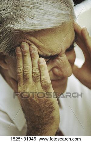 Man holding the side of his head in pain View Large Photo Image Stock Photograph - Man holding the side of his head in pain. Fotosearch