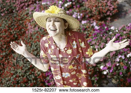 Mid adult woman looking up smiling View Large Photo Image Stock Photo - Mid adult woman looking up smiling. Fotosearch