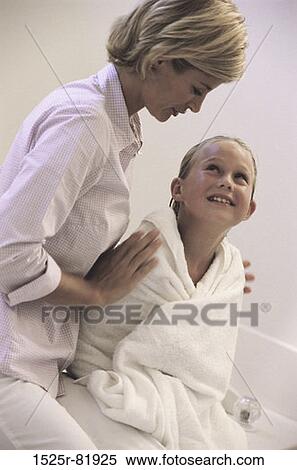 Stock Photography - Mother holding her daughter. Fotosearch