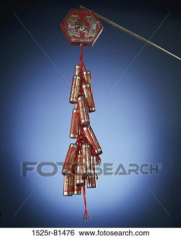 New Year's fire crackers suspended from a rope, China View Large Photo Image Stock Photograph - New Year's fire crackers suspended from a rope, China. Fotosearch