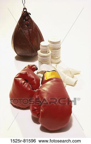 Pair of boxing gloves with a punching bag and bandage tape View Large Photo Image Stock Photograph - Pair of boxing gloves with a punching bag and bandage tape. Fotosearch