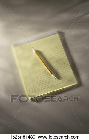Stock Image - Pencil lying on a pad. Fotosearch
