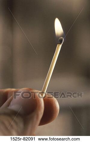 Person holding a burning matchstick View Large Photo Image Stock Image - Person holding a burning matchstick. Fotosearch