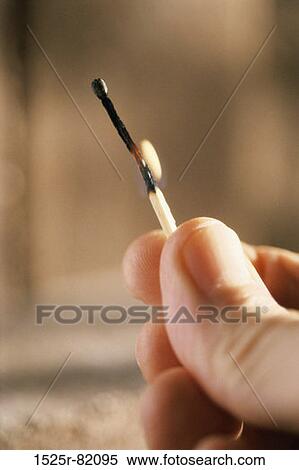 Person holding a burning matchstick View Large Photo Image Stock Photography - Person holding a burning matchstick. Fotosearch