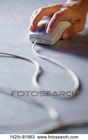 Stock Image - Person operating a computer mouse. Fotosearch