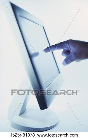 Person's finger pointing to a computer monitor View Large Photo Image Stock Photo - Person's finger pointing to a computer monitor. Fotosearch