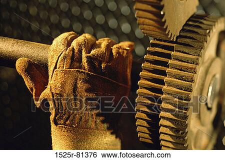 Person's gloved hand holding a shaft View Large Photo Image Stock Photograph - Person's gloved hand holding a shaft. Fotosearch