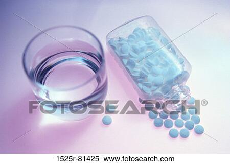 Pills spilt from a bottle and a glass of water View Large Photo Image Stock Photography - Pills spilt from a bottle and a glass of water. Fotosearch