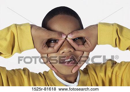 Portrait of a boy making a face View Large Photo Image Stock Photo - Portrait of a boy making a face. Fotosearch
