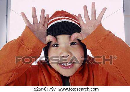 Portrait of a boy making a face View Large Photo Image Stock Photo - Portrait of a boy making a face. Fotosearch